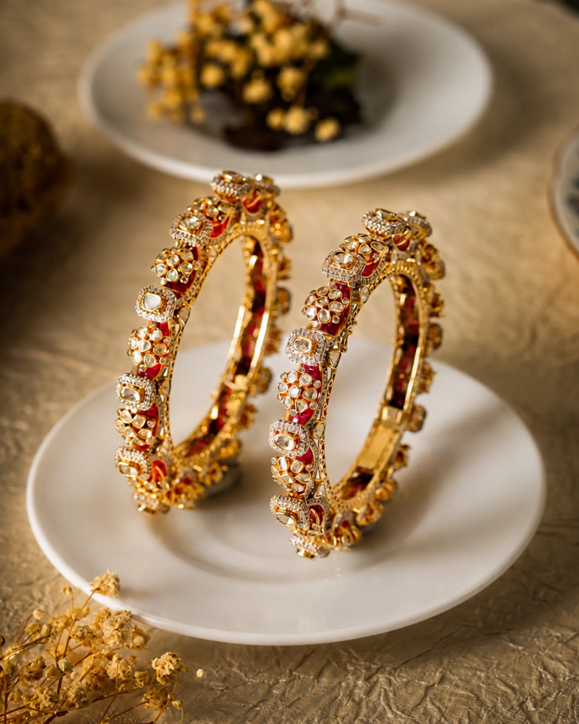 Pair of polki and ruby bangles set in gold