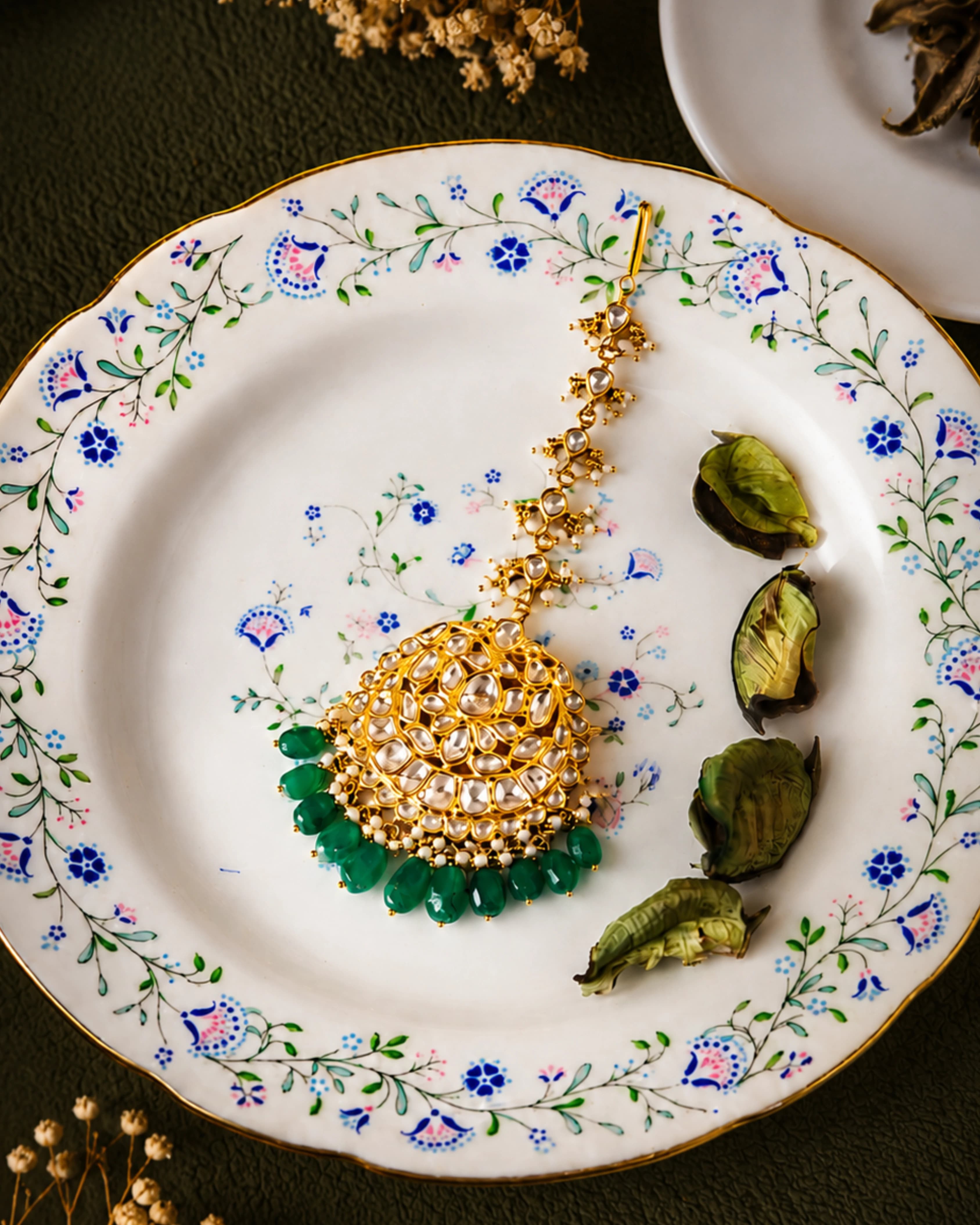 Domed polki maang tikka finished with emerald drops